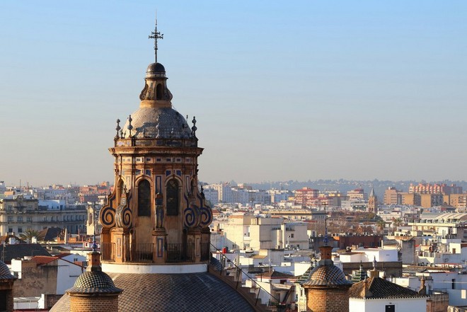 A view overlooking the city of Seville with the tower of the Church of the Annunciation closer in the mid-ground