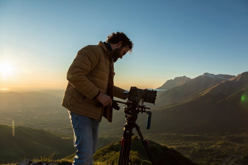 A side profile of Canon Ambassador Ivan D'Antonio with his eye to the viewfinder of a Canon EOS R5 camera.