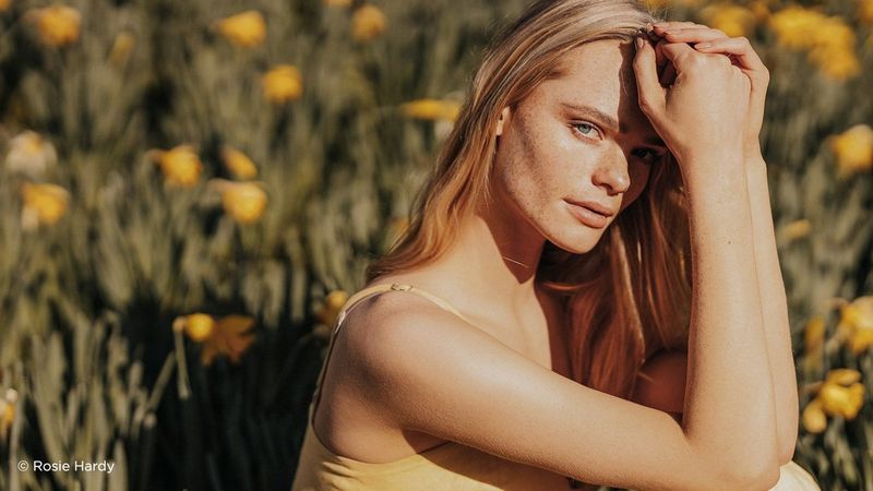 Female model flower field