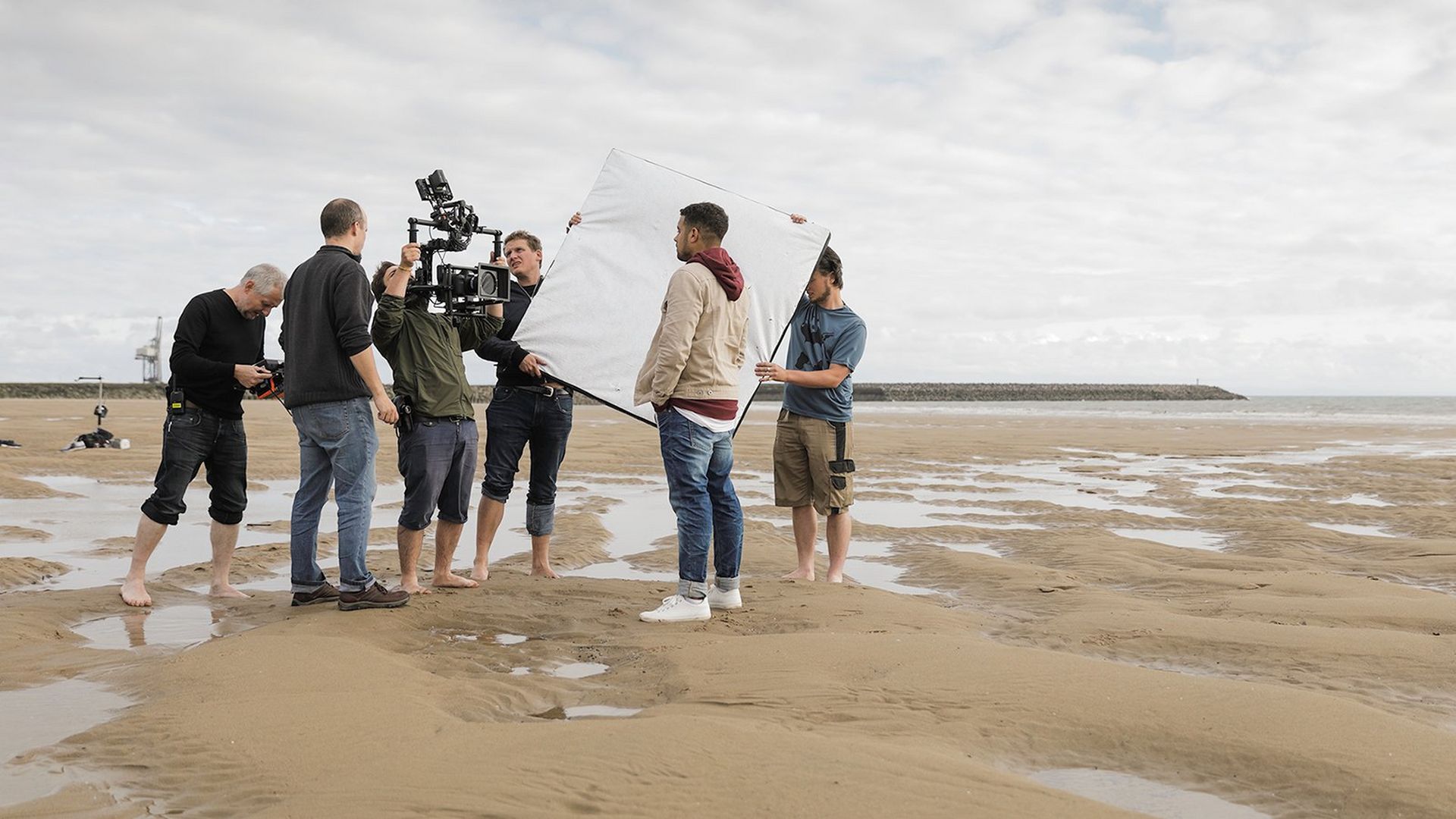 Filming with the й on a beach