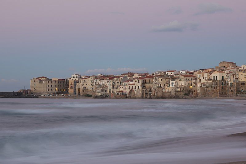 tide coming in over sandy beach