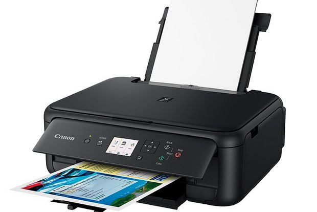A Canon PIXMA TS5140 printer with its paper tray extended.