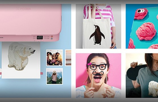 A printout on a printer tray of an iron-on transfer of a polar bear, different print applications, smartphone, cloth bag, t-shirt and party glasses.