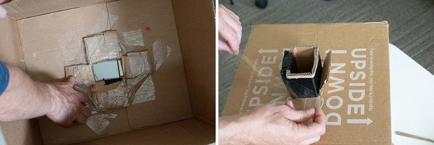 The inside of a large cardboard box with the flaps of the cardboard sheath secured inside.