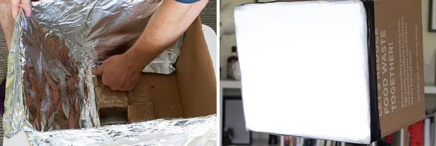 The inside of a large cardboard box being lined with reflective foil.