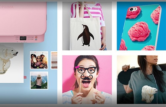 A printout on a printer tray of an iron-on transfer of a polar bear, different print applications, smartphone, cloth bag, T-shirt, party glasses.