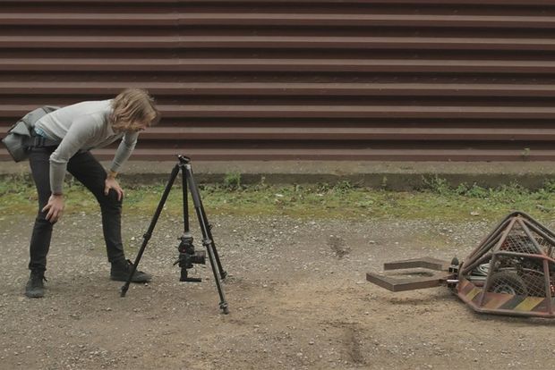 Geoff leaning over EOS 80D on a tripod filming a robot.