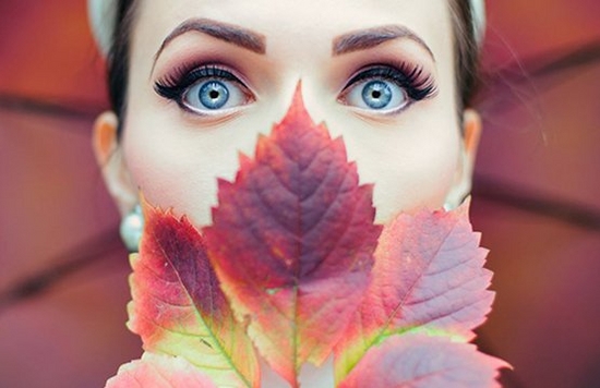 girl poses with leaf