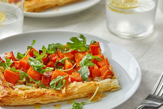 Pea fritters on a plate, shot from the side. 
