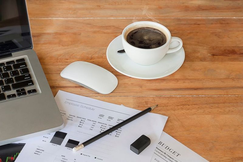 an image of a laptop and documents