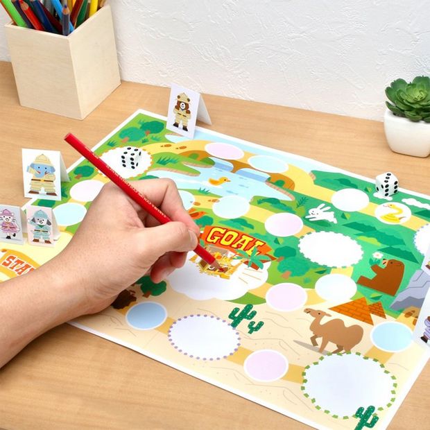 A colourful, customisable printed board game, with papercrafted characters on a tabletop.