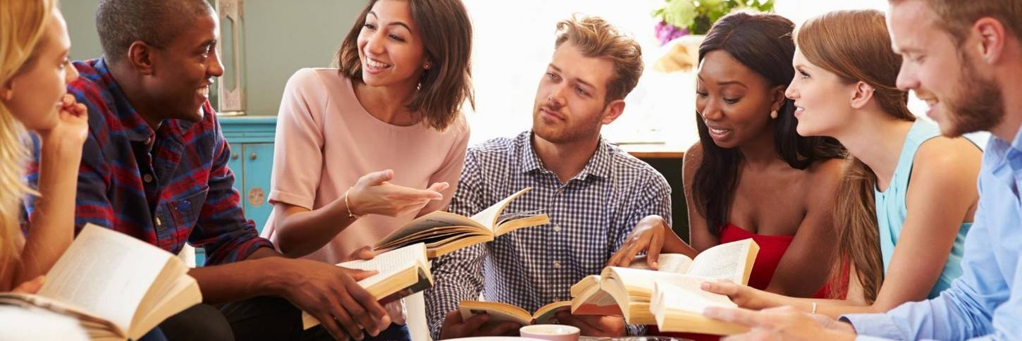 Group of friends taking part in book club