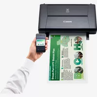 Canon PIXMA iP110 with Battery Product Front View With A Person Printing From a Smartphone