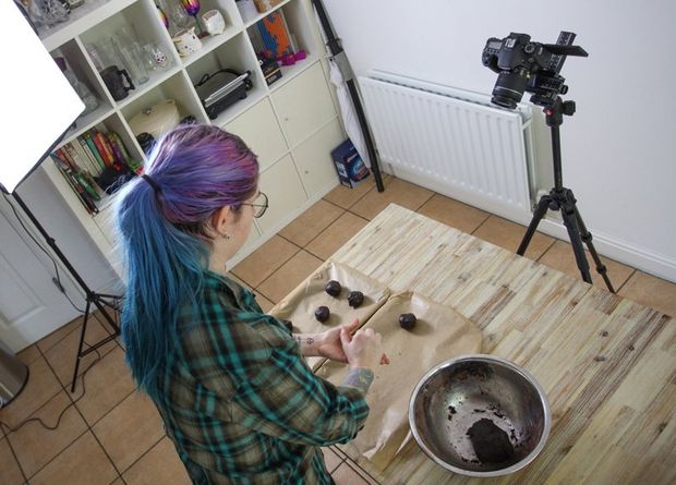 A Canon EF 100mm f/2.8 Macro USM lens. A woman with multi-coloured hair making cookies.