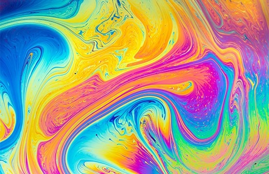 A macro shot of soap mixing with water.