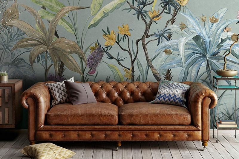 Vintage couch against a wall with wallpaper on it - Canon UK