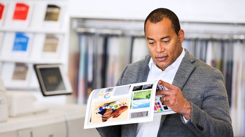 Work professional reviewing a print out