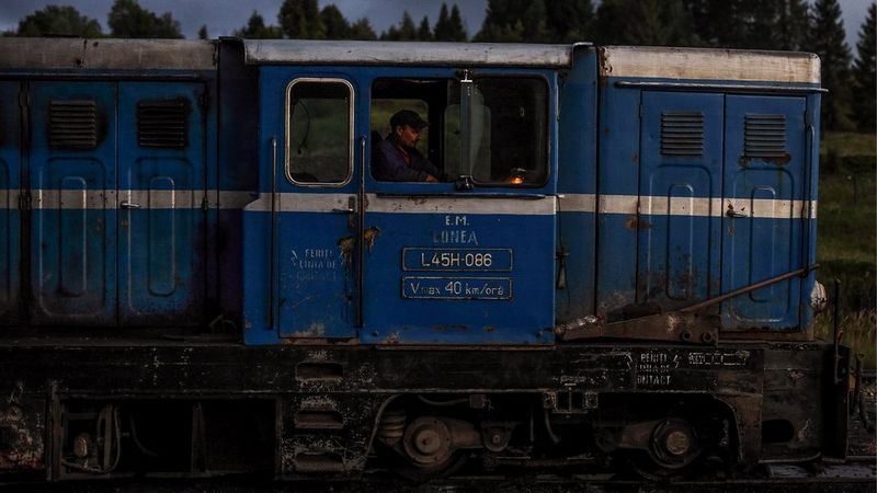 Mine worker driving a train in Romania shot on the Canon EOS R & RF 50mm F1.2L USM