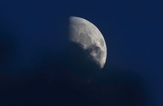 A close-up of the Moon, with only about a quarter of it visible, taken on a Canon EOS R8 by astrophotographer Mara Leite.