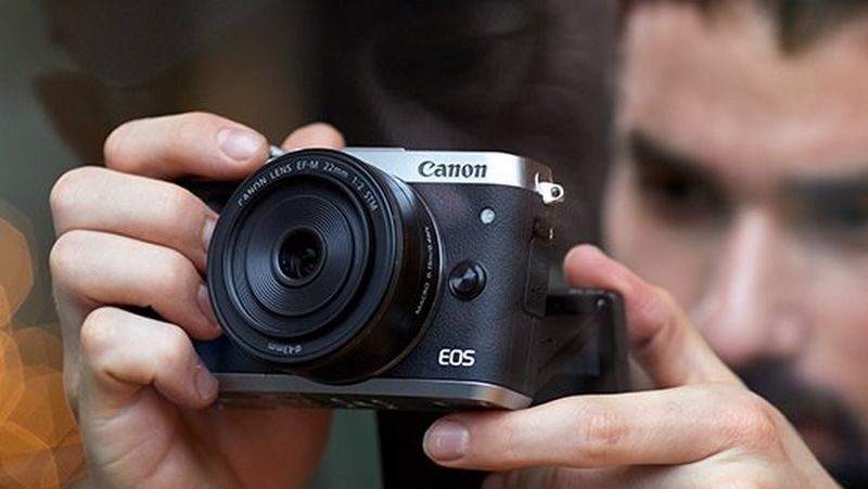 A scenic image of the silhouette of a person in the foreground with a space scene in full colour in the background