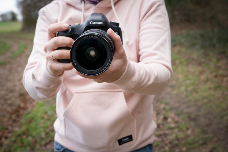 Holding a camera far away from your body, without adequate support.