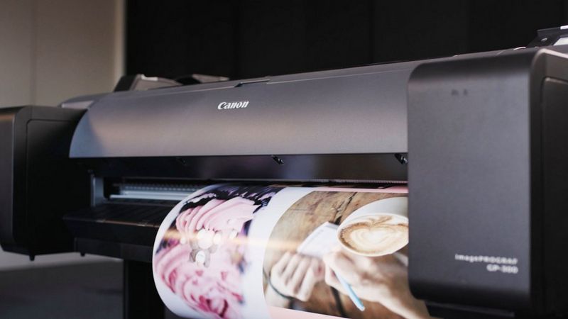 Picture of Canon printer printing high definition images.