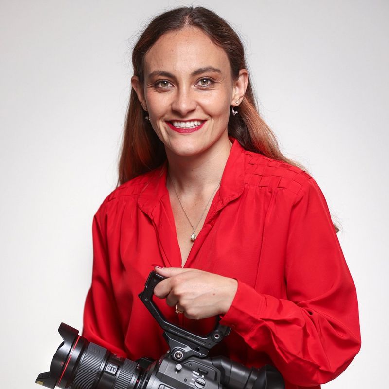 Cinematographer and Canon Video Ambassador Elisa Iannacone holding a Canon Cinema EOS camera.