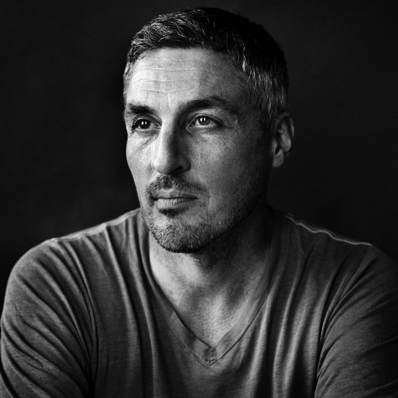 Black and white headshot of Canon Ambassador and leading news photojournalist Finbarr O'Reilly.