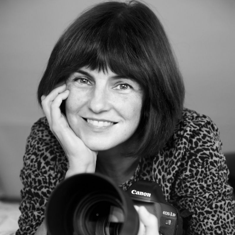 Canon Ambassador Marina Cano holds a Canon camera fitted with a telephoto lens