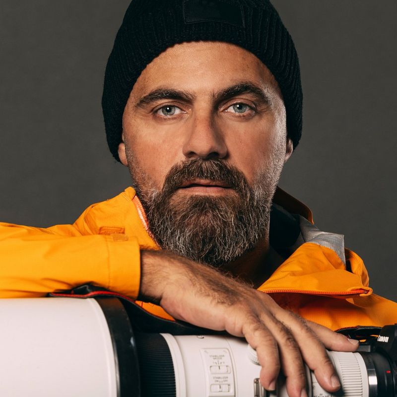 A headshot of Canon Ambassador Naim Chidiac resting his hand on a Canon lens.