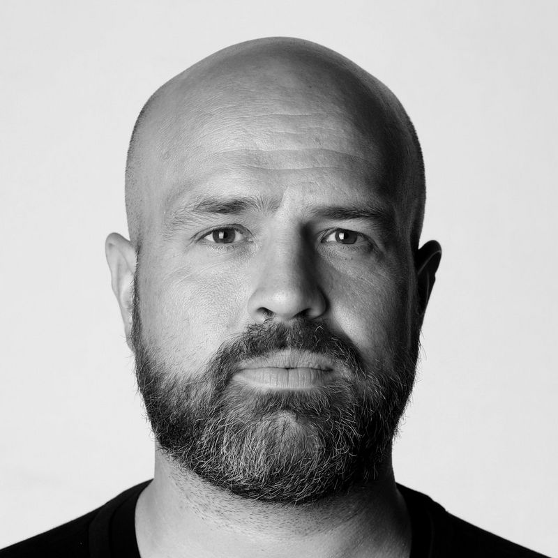 A black and white headshot of Canon Ambassador Richard Heathcote.