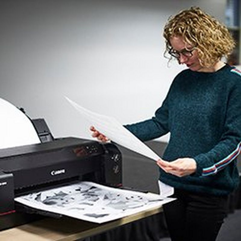 Printing specialist Jay Sinclair shows family photographer Helen Bartlett how to produce great black and white prints of her photos.