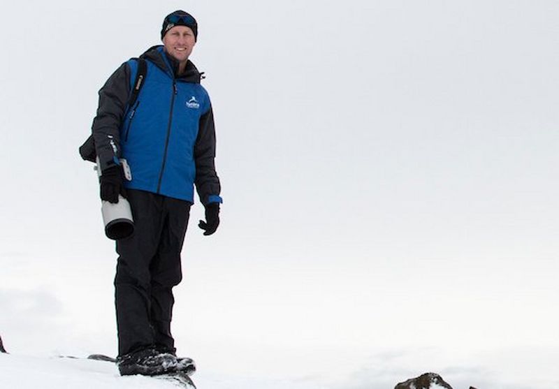 Photographer and Canon Ambassador Chris Fallows with a Canon camera and long lens.