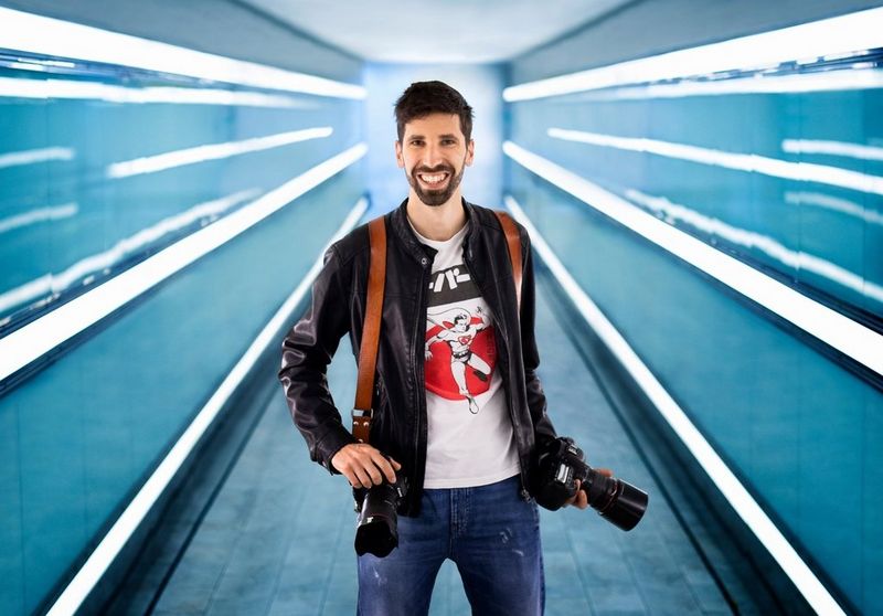 Photographer and Canon Ambassador Fabio Mirulla with two Canon cameras.