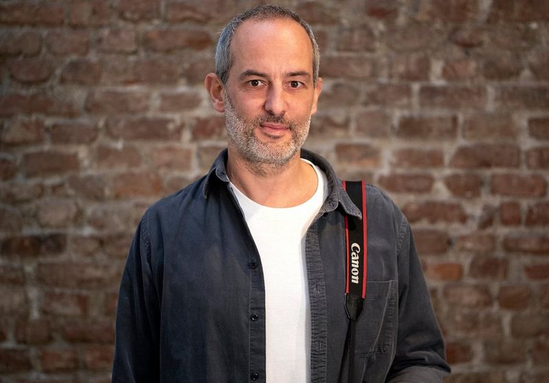 Photographer and Canon Ambassador Gabriele Galimberti with a Canon camera.