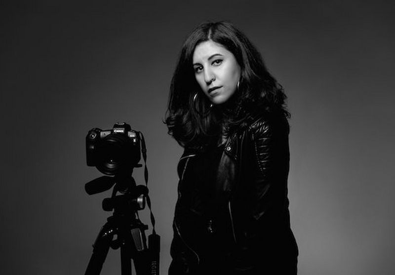 Photographer and Canon Ambassador Menna Hossam with her Canon camera on a tripod.