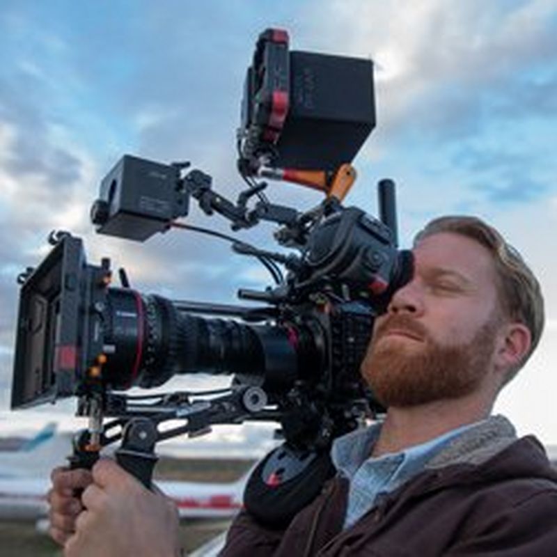 Cinematographer Steve Holleran holds a Canon EOS C300 Mark III on his shoulder.