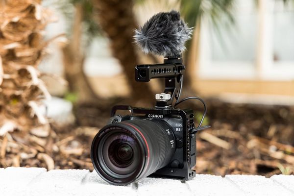 A Canon EOS R5 in a gimbal with an external microphone.