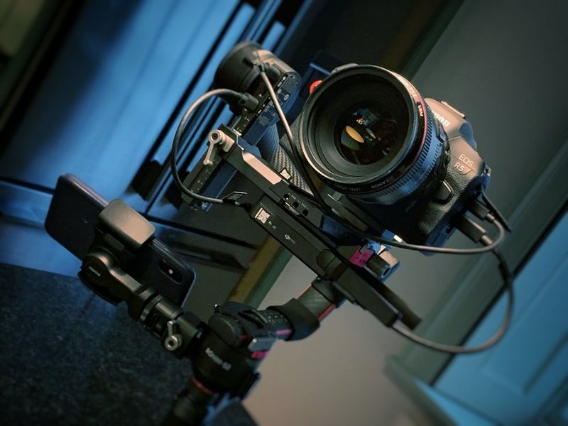 A Canon EOS R5 attached to a filming rig on set.