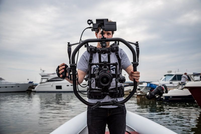 Jonathan Constantinou demonstrates his shooting rig to the camera.