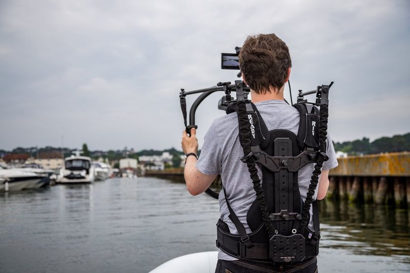Camera poised and ready, Jonathan Constantinou watches the water.
