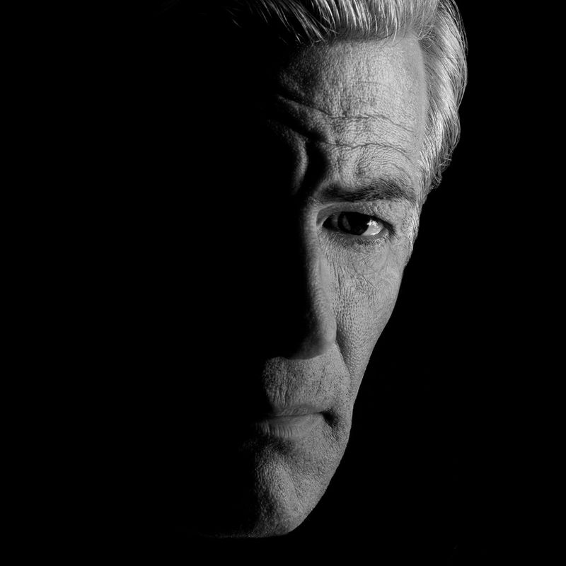 A black and white self portrait of photographer James Nachtwey.