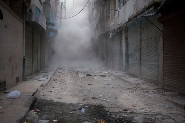 An avalanche of dust engulfs shop fronts in al-Arkub, Aleppo.