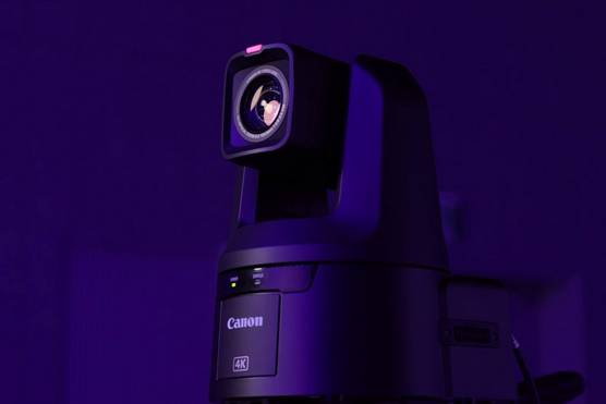 A Canon PTZ camera against a dark background.