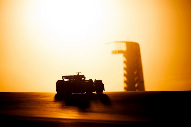 A silhouette of a Formula 1 car, against the sun, taken on a Canon EOS R3 with a Canon RF 400mm F2.8L IS USM lens by Vladimir Rys.