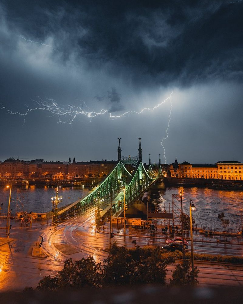 A photograph by Steven Herteleer captures the lightning above a city.