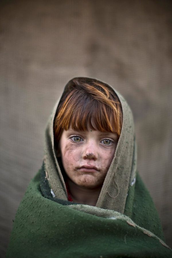 A portrait of Laiba Hazrat, a six-year-old Afghan refugee.