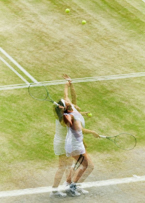 A multiple exposure photograph of a female player serving at the 2019 Wimbledon Championships Girls' Singles final.