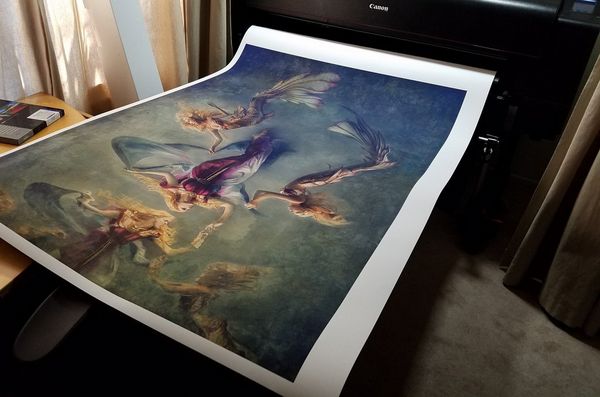 A large fine art style print emerges from a Canon imagePROGRAF PRO-4100 printer. 