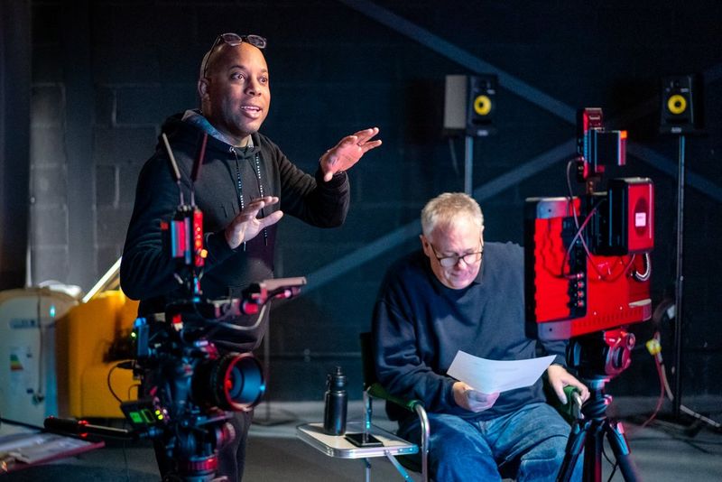 wo men behind the scenes on a corporate video shoot.